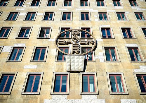 The unique Bayer cross hangs on the facade of a plant building in Leverkusen, Germany.