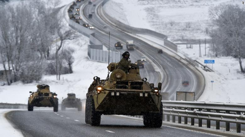 A convoy of Russian armoured vehicles moves along a highway in Crimea earlier this month.