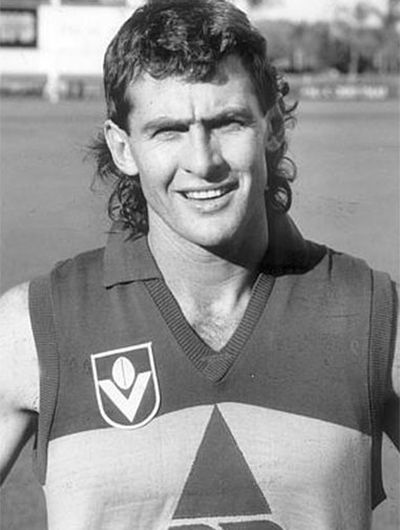 He played 60 games for the Brisbane Bears from 1987 to 1990.