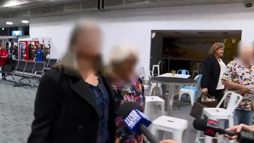 A woman arrested in Taree where she was in hiding with her daughters had been helped by a syndicate including people arrested in police raids today, it has been alleged.