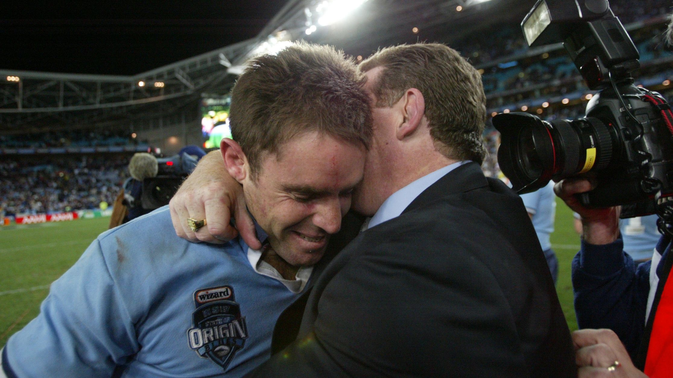 NSW coach Phil Gould hugs Brad Fittler after the NSW claimed victory in Origin III at Telstra Stadium, Wednesday 7 July 2004. Photo: Craig Golding