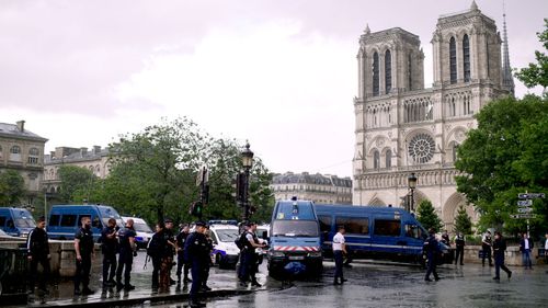 Emergency services swarm on Notre Dame cathedral in central Paris after a man is shot. (AFP)