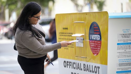 A ballot being dropped off on Election Day at the Registrar of Voters office today in Norwalk, Calif.