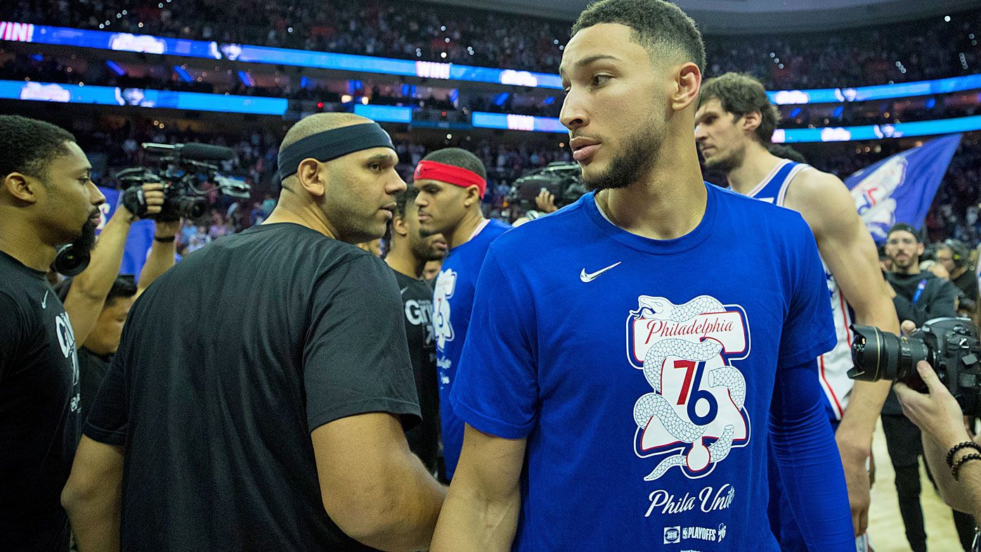 Ben Simmons #25 of the Philadelphia 76ers walks past Jared Dudley #6 of the Brooklyn Nets