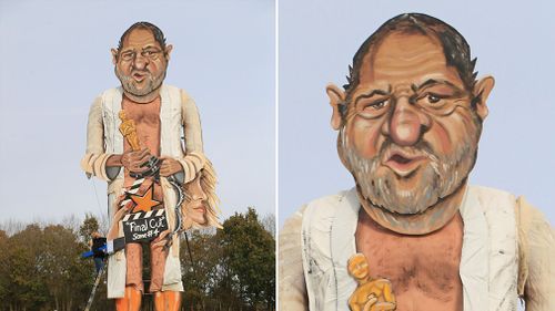 Artists Frank Shepherd and Andrea Deans put the finishing touches to the Edenbridge Bonfire Society effigy, which has been unveiled as Harvey Weinstein, for Bonfire Night in Edenbridge, England. (AP)