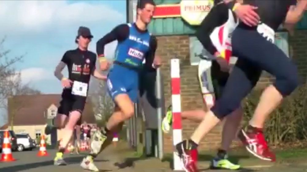 Marathon runner gets nasty surprise with blow to the groin
