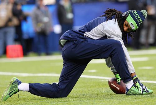 Controversial Seahawks star cornerback Richard Sherman stretched.