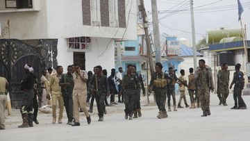 Soldiers patrol outside the Hayat Hotel in Mogadishu, Somalia, Saturday Aug, 20, 2022. 