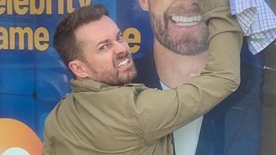 Grant Denyer cleans up vandalism.