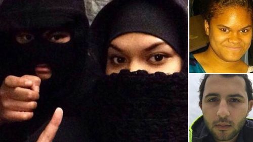 'Islamic Bonnie and Clyde' accused of plotting terror attack kiss and cuddle in the dock
