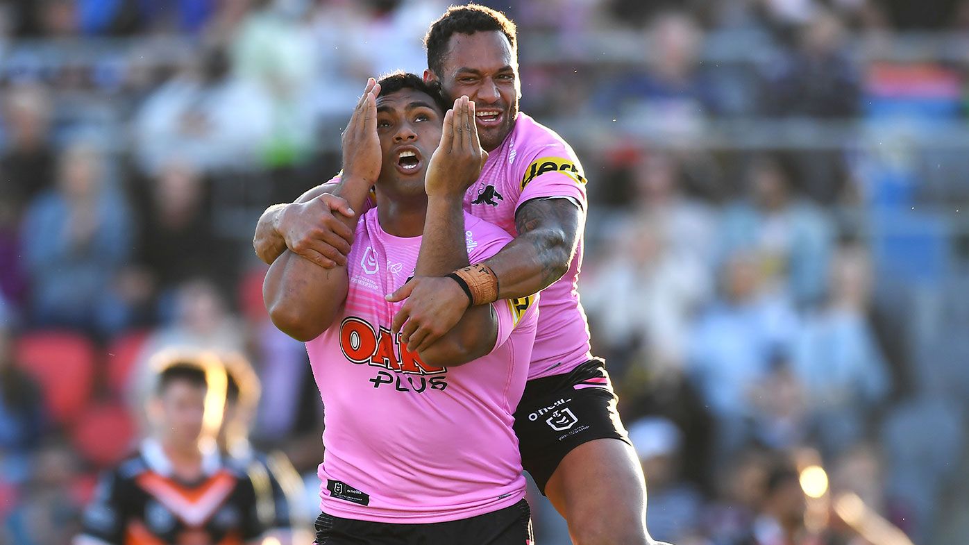 Tevita Pangai Junior of the Panthers celebrates with Apisai Koroisau of the Panthers after scoring a try during the round 24 NRL match between the Penrith Panthers and the Wests Tigers at Moreton Daily Stadium on August 29, 2021, in Brisbane, Australia. (Photo by Albert Perez/Getty Images)