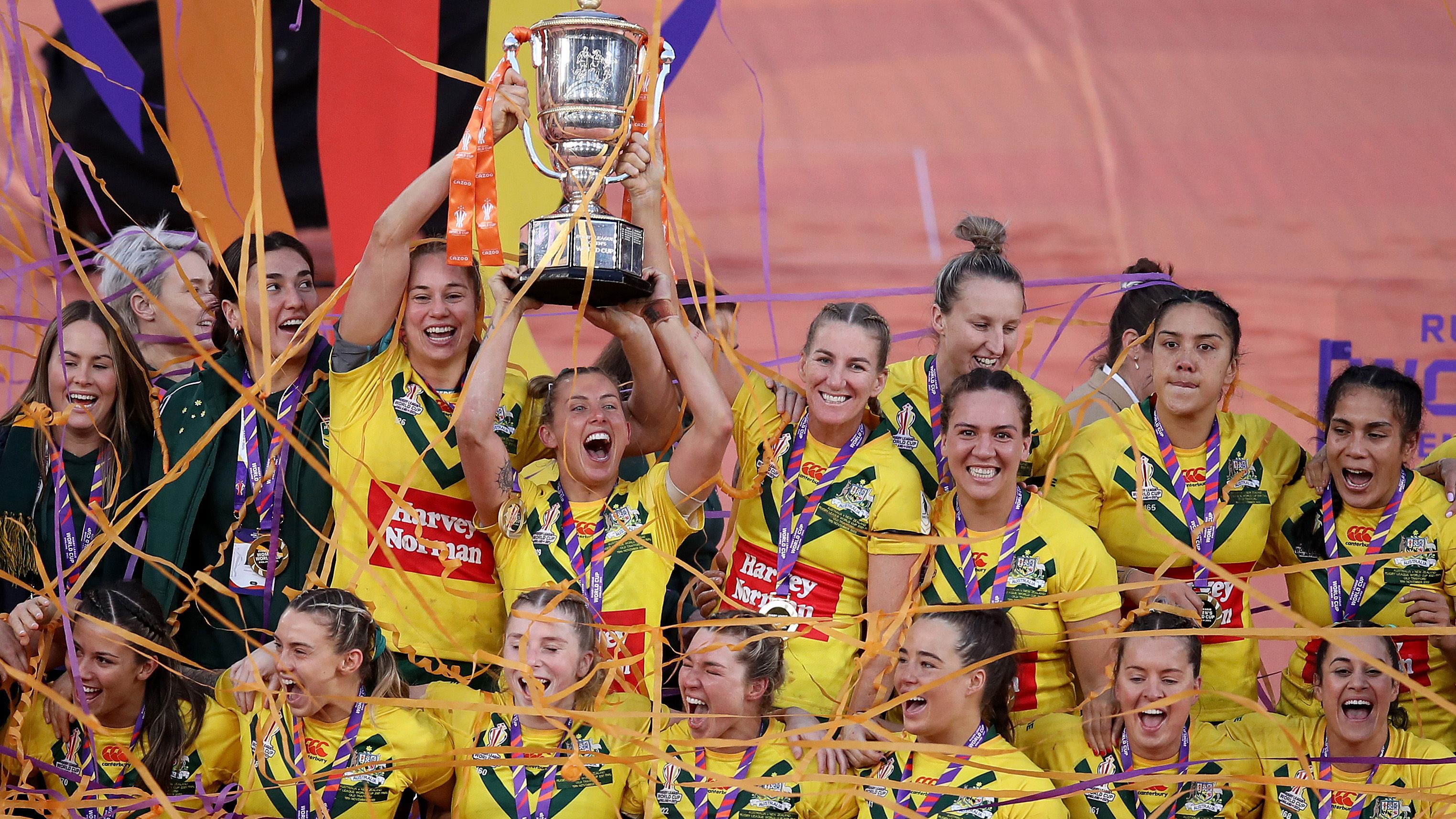 Samantha Bremner of Australia lifts the Women&#x27;s Rugby League World Cup trophy with teammates following victory in the Women&#x27;s Rugby League World Cup Final match between Australia and New Zealand at Old Trafford on November 19, 2022 in Manchester, England. (Photo by George Wood/Getty Images)
