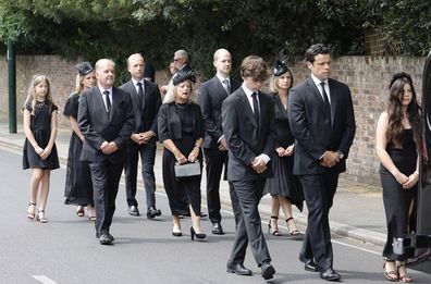 Hugo Bowen, Sebastien Bowen and Eloise Bowen lead the procession with (L-R second row) parents Alistair James, Heather James and brother Ben James during the funeral of Dame Deborah James at St Mary's Church on July 20, 2022 in Barnes, England.  
