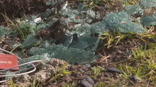 Parts of the shattered windscreen and debris remain at the scene of the horror double fatality.