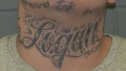 Jones has several distinct tattoos, including on his neck which bears the name "Logan'. (SA Police)