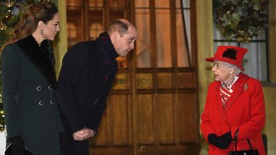 The Queen and Prince William meet in the quandrangle at Windsor Castle. 