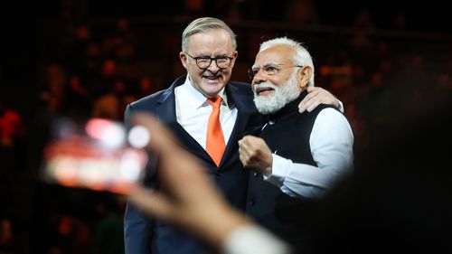 India's Prime Minister Narendra Modi (R) and Australia's Prime Minister Anthony Albanese