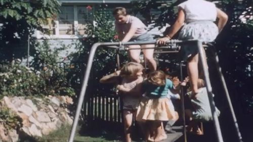 The Bennett's swingset wasn't quite big enough for all of his children. Picture: State Library of Queensland Reel Rescue