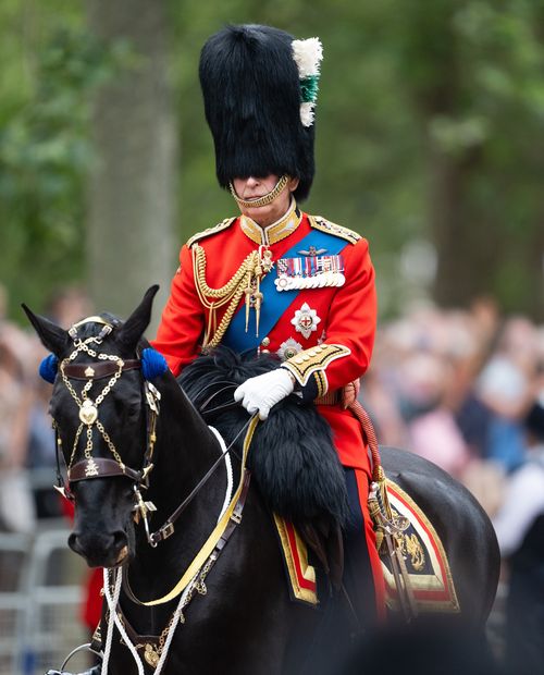 Charles presents flag to mounted cavalry ahead of first birthday parade