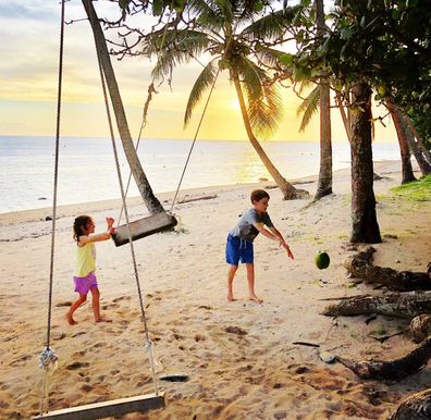 Kids playing on a tropical beach