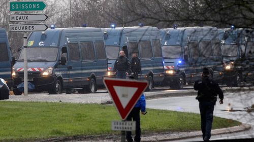 Police vans are lined up in Dammartin-en-Goele.