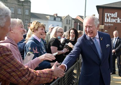 His Royal Highness Prince Charles chats to members of the public as he visits C.S. Lewis Square, named after the Belfast born author of the Narnia Chronicles on March 23, 2022 in Belfast, Northern Ireland.  