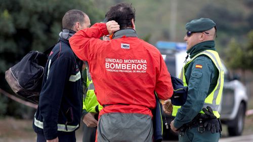 Rescuers of the young boy at the site of the deep borehole in southern Spain.