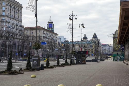 An empty street is seen due to curfew in the central of Kyiv, Ukraine, Sunday, Feb. 27, 2022.