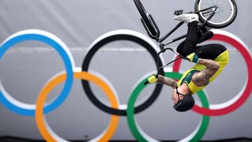 BMX athlete Logan Martin of Australia in action in front of the Olympic rings