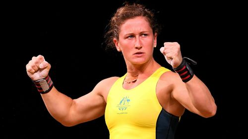 Tia-Clair Toomey gestures after a successful lift in the Commonwealth Games. (AAP)