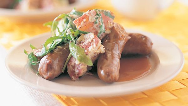 Snags with warm rocket and potato salad