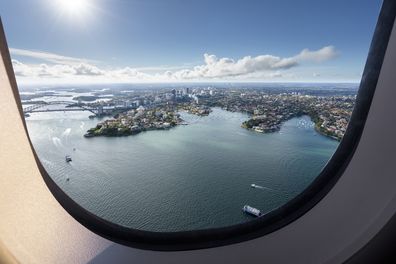 Aircraft window view of Sydney Harbour Bridge in Australia.
