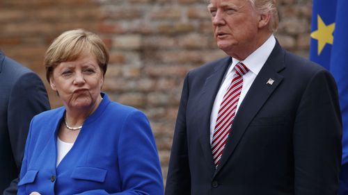 German Chancellor Angela Merkel and President Donald Trump pose for a photo with G7 leaders on May 26, 2017, in Italy. Photo: AP