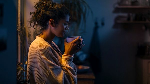 Woman holding a cup of tea.