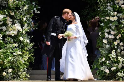 Prince Harry and Meghan Markle kiss as they leave at St. George's Chapel in Windsor Castle after their wedding ceremony. 