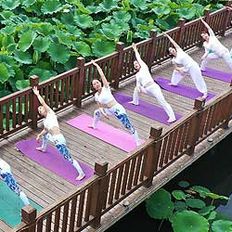 Women in Heibei practising yoga on bridge (Getty)