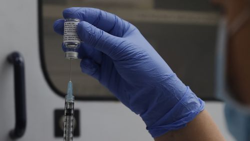 A vial of the Phase 3 Novavax coronavirus vaccine is seen ready for use in the trial