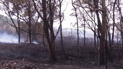 The fire came within metres of homes.