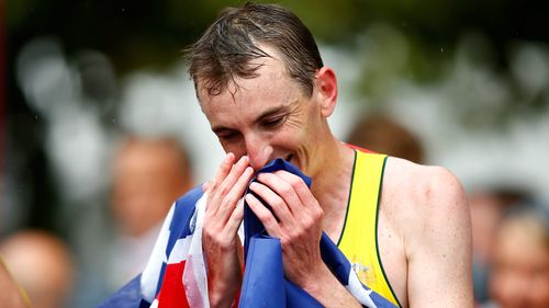 Michael Shelley celebrates after winning the marathon at the Commonwealth Games in Glasgow. (AAP)