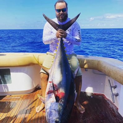 Connor Cruise, 26, shared a rare photo of him on a fishing trip.