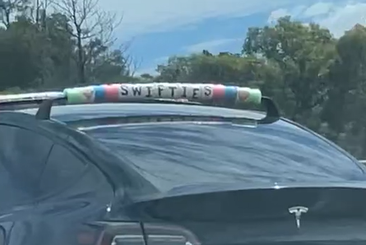 Car with Taylor Swift friendship bracelet decorations on roof racks