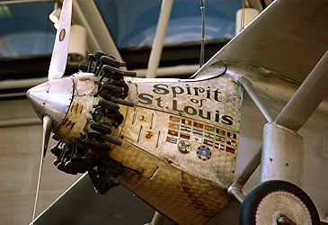 Where did Charles Lindbergh's first solo transatlantic flight land?