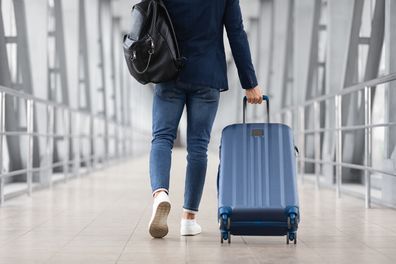 Man walking with suitcase 