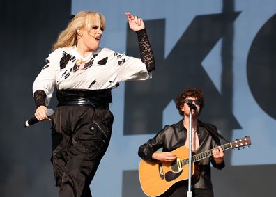 READING, ENGLAND - AUGUST 22: (EDITORIAL USE ONLY) Actress Rebel Wilson makes a surprise appearance on stage with The Kooks and performs 'Gangstas Paradise' during day one of Reading Festival 2025 at Richfield Avenue on August 22, 2025 in Reading, England. (Photo by Simone Joyner/Getty Images)