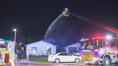 Firefighters work to extinguish the blaze.