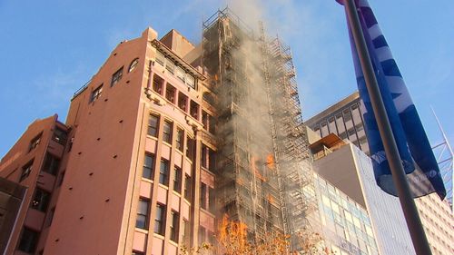 Lockhard Chambers on Macquarie Street erupted in flames only days after its cladding was removed. Picture: 9NEWS