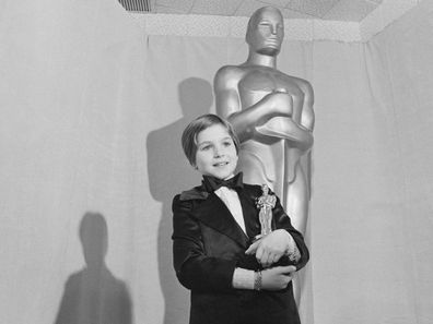Tatum O'Neal holds the Oscar she won for working alongside her father in the movie Paper Moon. At 9 years old, O'Neal was one of the youngest Oscar winners ever.