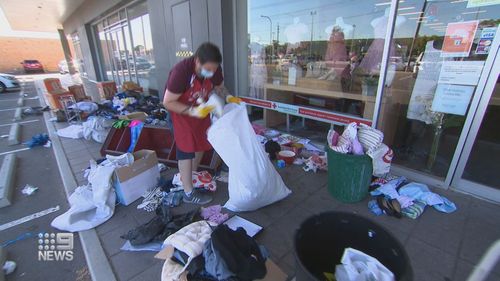 Workers have spent hours this morning cleaning up piles of clothes, toys and Christmas trees, some of which now can't be sold to those in need.