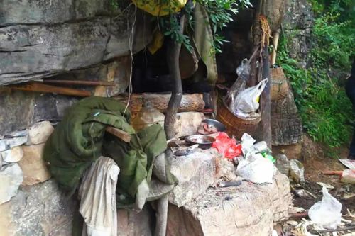 The entrance to Song Jiang's cave hideout. A drone spotted some rubbish outside the cave while flying above Jiang's mountain home.