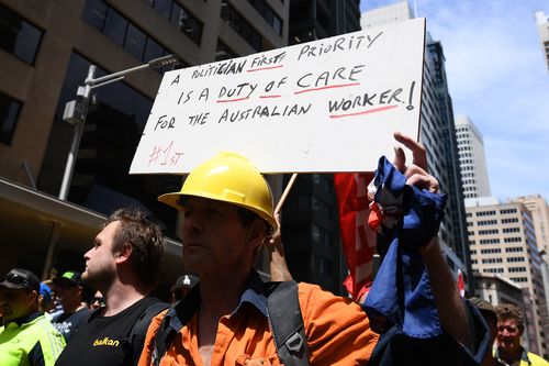 Protesters have accused the PM of taking workers on a "highway to hell."